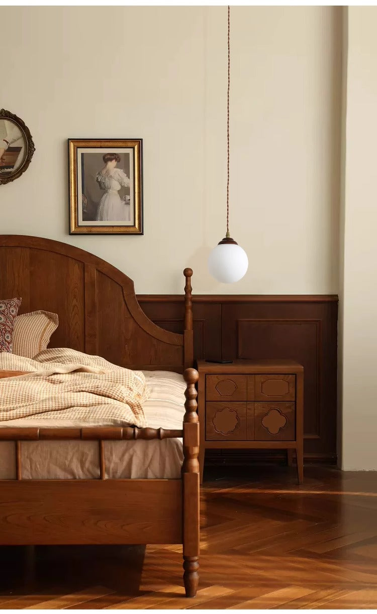 Kiven pendant light, antique wooden bed, and nightstand create a warm bedroom atmosphere for dining room or cafe.