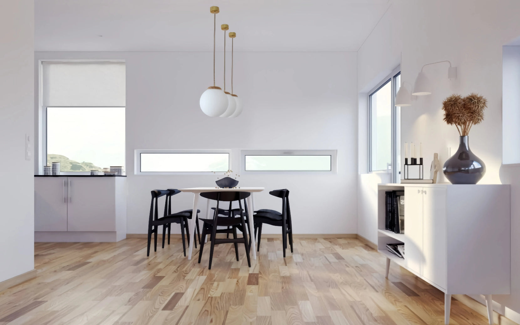 Modern glass globe pendant lights in a minimalist dining room setting, with white table and black chairs.  Kitchen lighting.