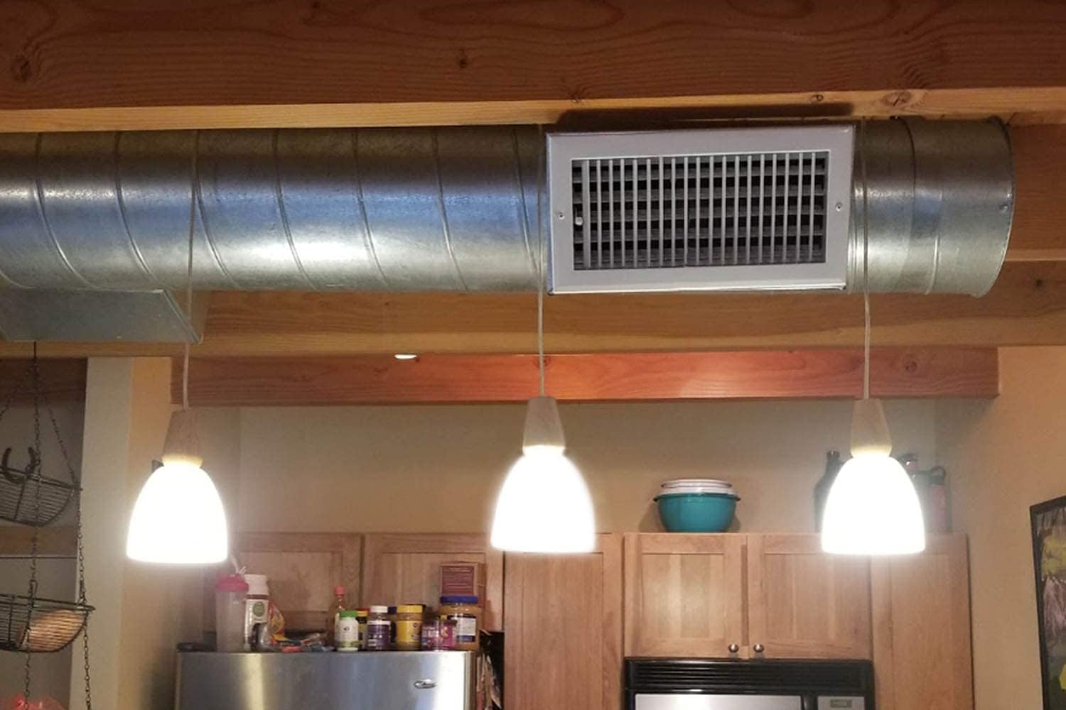 Kiven 3-Light H-Type pendant lights with wood accents and white glass shades in kitchen. Ideal bar track lighting.