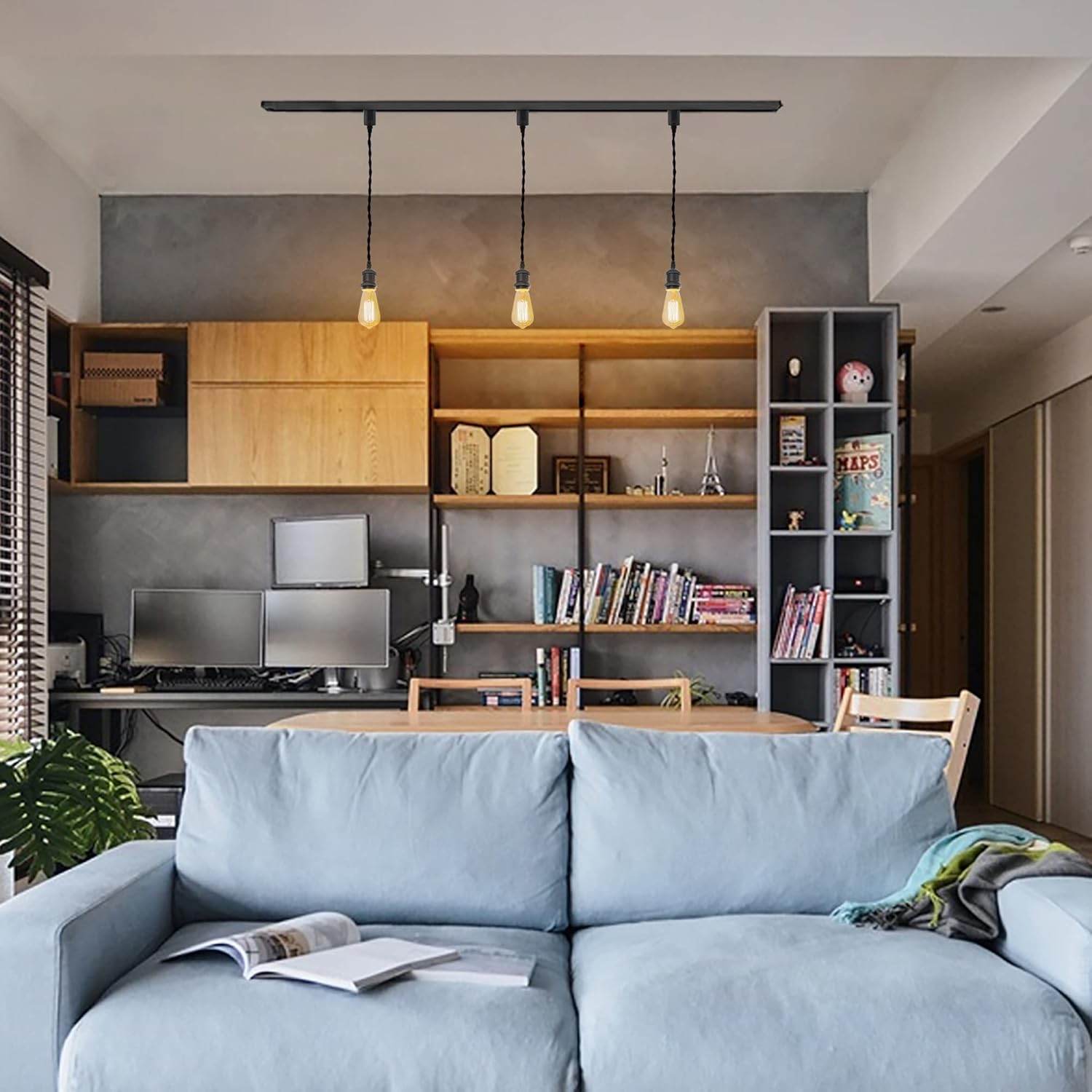 Black Kiven H-Type track light pendant with Edison bulbs, illuminating a modern living room. Industrial design.