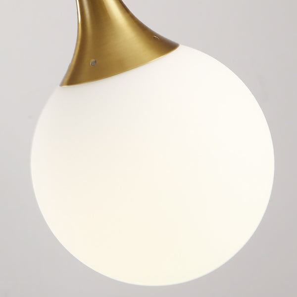 Kiven Nordic pendant light showcasing gold metal and milk white glass globe, ideal for modern dining and bar decor