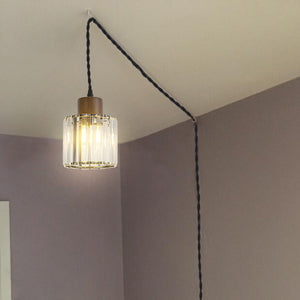 Crystal shade hanging plug-in pendant light with wooden top and black cord, ideal for stylish living room lighting.