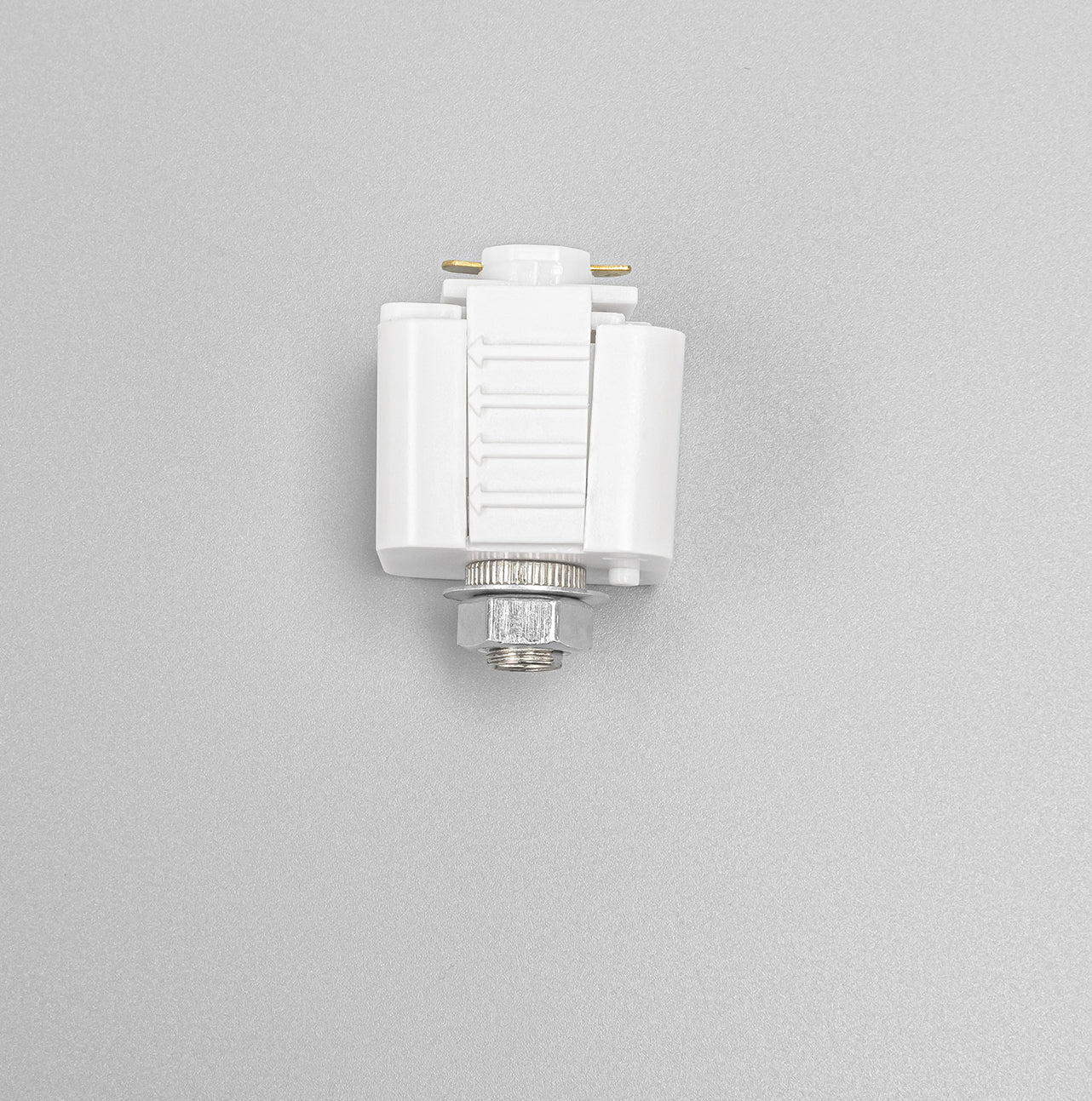 White Lightolier L system track adapter fitting with metallic bolt; stage lighting compatible.