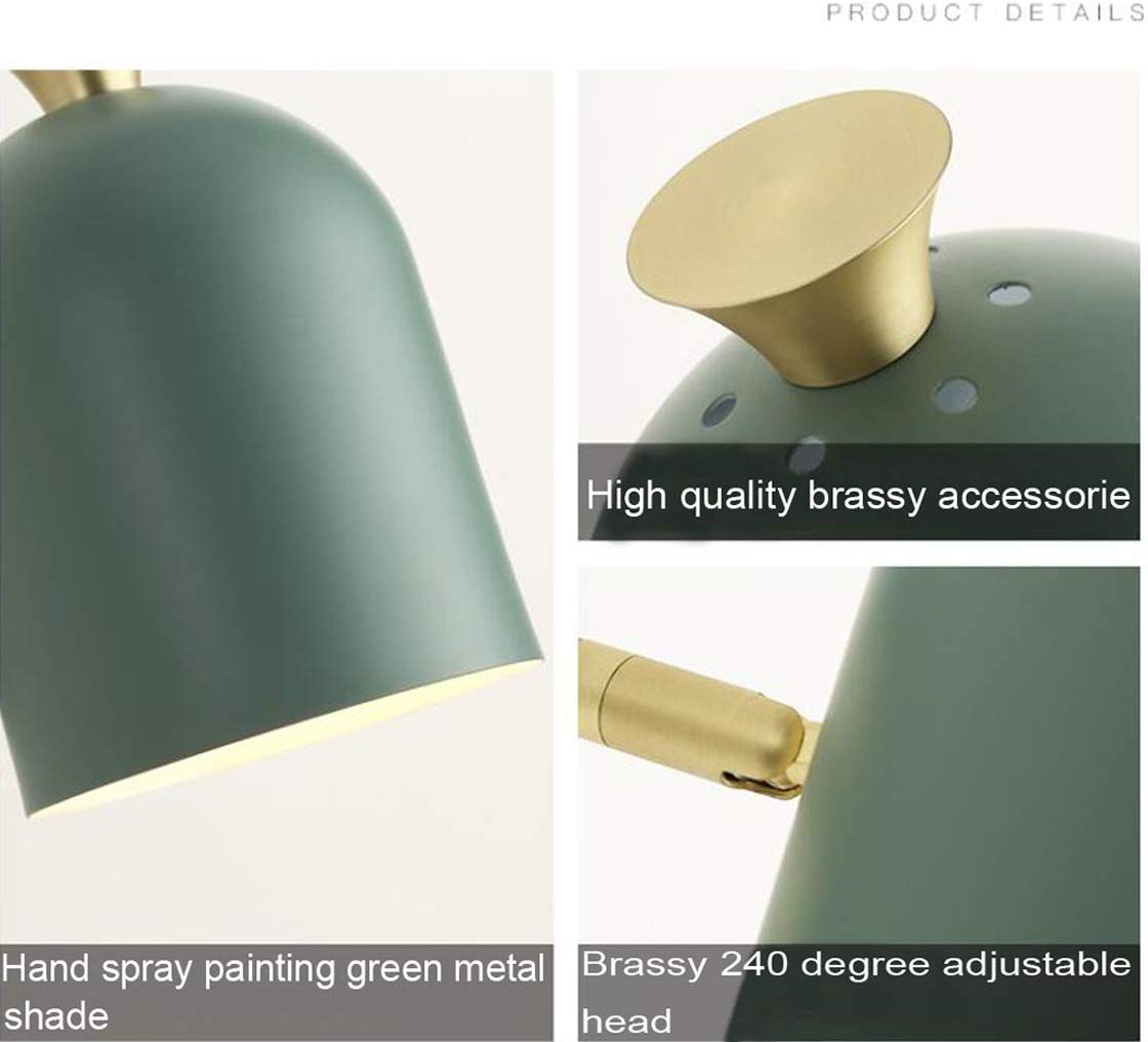 Green mid-century modern wall sconce with brass accents. Adjustable head. Kiven Lighting plug-in wall lamp.