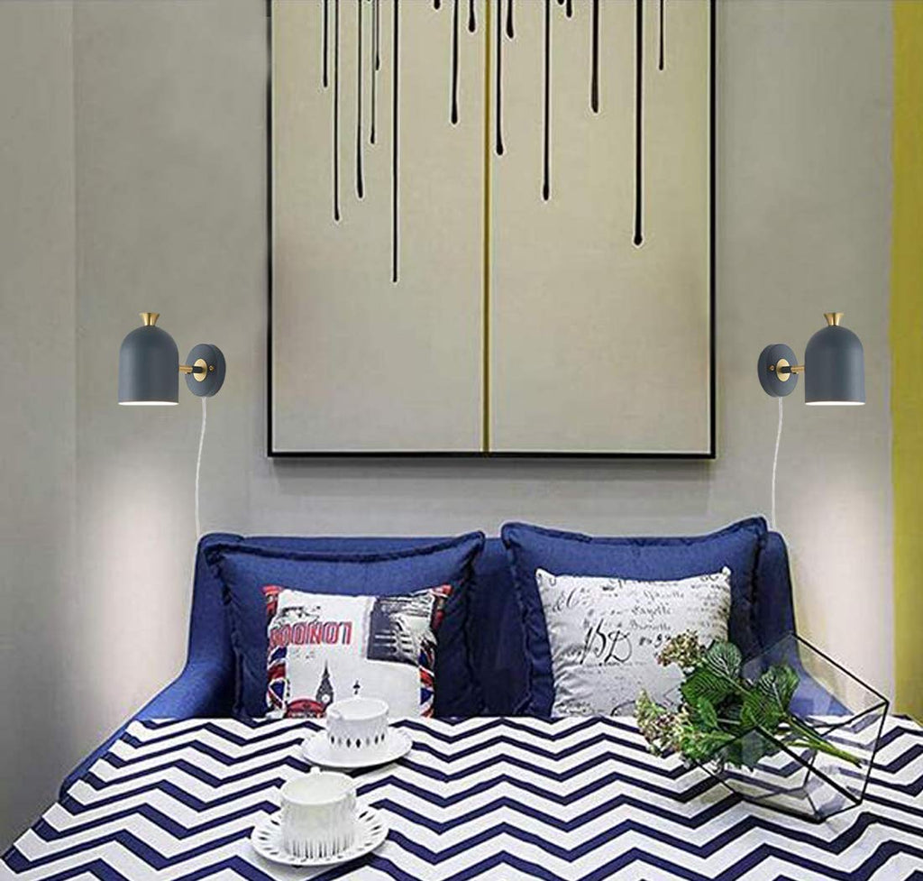 Modern gray plug-in wall sconce with brass accents, Kiven Lighting, ideal for modern interior.