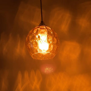 Green glass pendant light with E26 screw-in adapter, ideal for kitchen island lighting. Farmhouse style with adjustable cord.