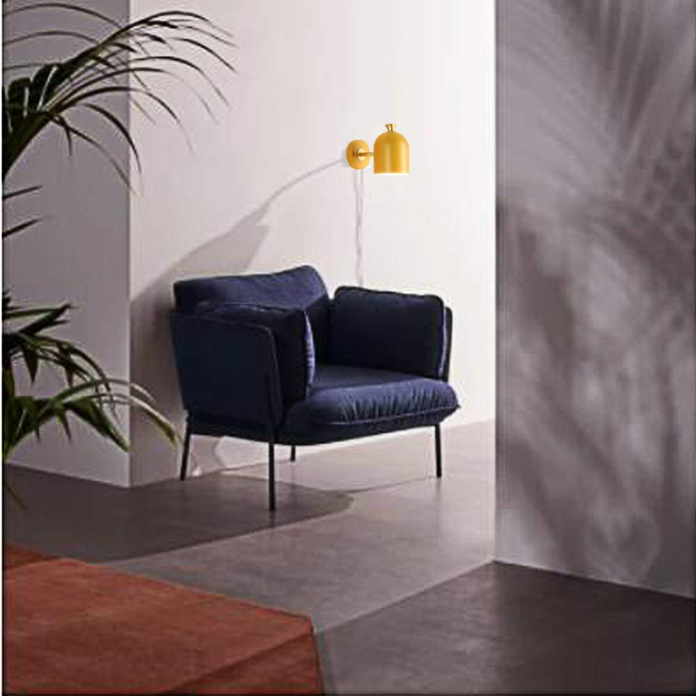 Yellow mid-century modern wall sconce with brass accents, plug-in design. Kiven Lighting, ideal for modern interior.