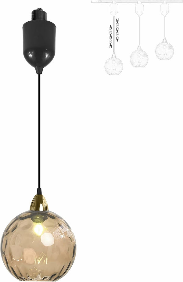Orange hammered glass Juno track pendant light, vintage style, adjustable height, ideal for kitchen or bar lighting.