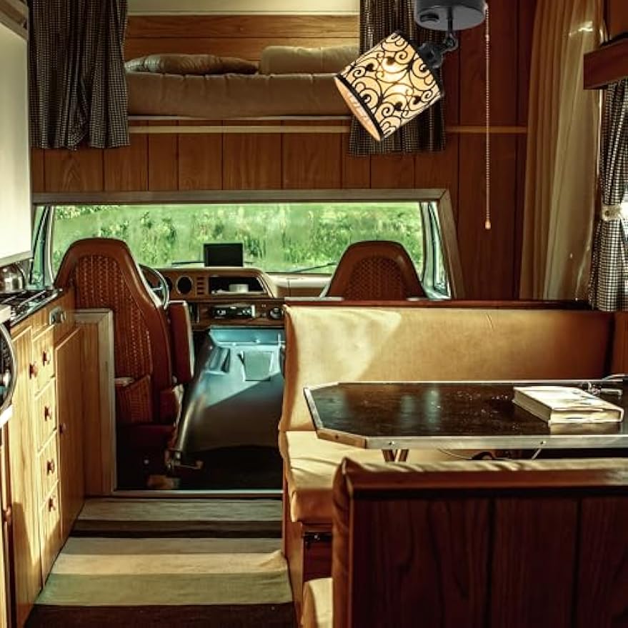 Black adjustable RV ceiling light with hollowed-out design, perfect for vintage camper interior, pull chain operation.