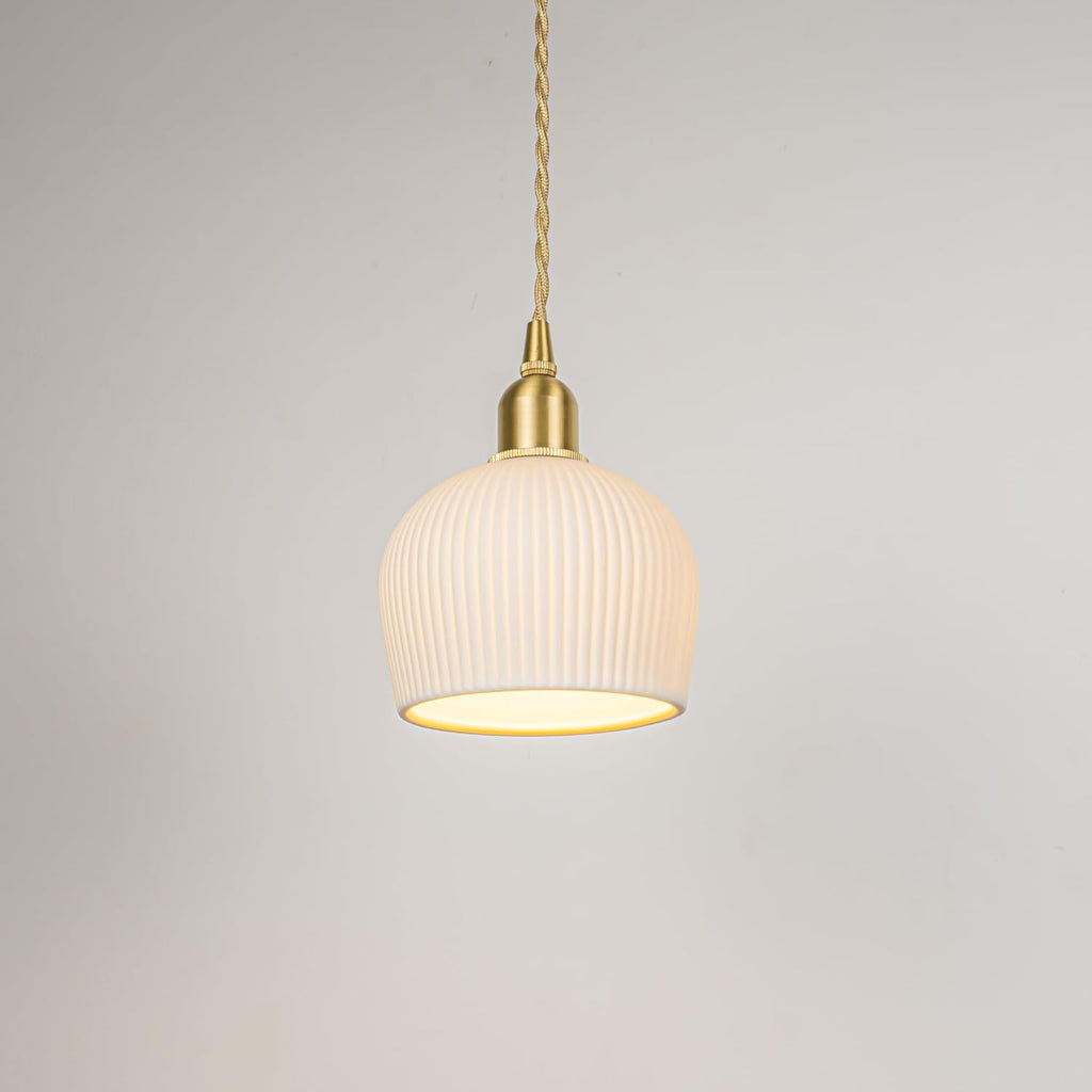 White ribbed ceramic pendant light with gold accents. Adjustable cord for sloped track lighting.