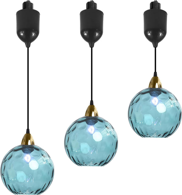 Three blue hammered glass Juno track pendants with adjustable height, kitchen and bar lighting.