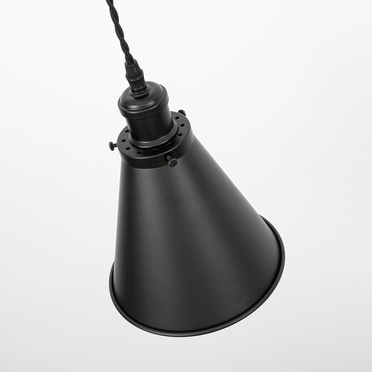 Black cone shade track lamp with adjustable cord. Vintage-style pendant lighting for home and commercial spaces.