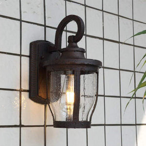 Vintage plug-in wall light, dark bronze finish with bubble glass shade, ideal for outdoor or indoor use, Kiven Lighting.