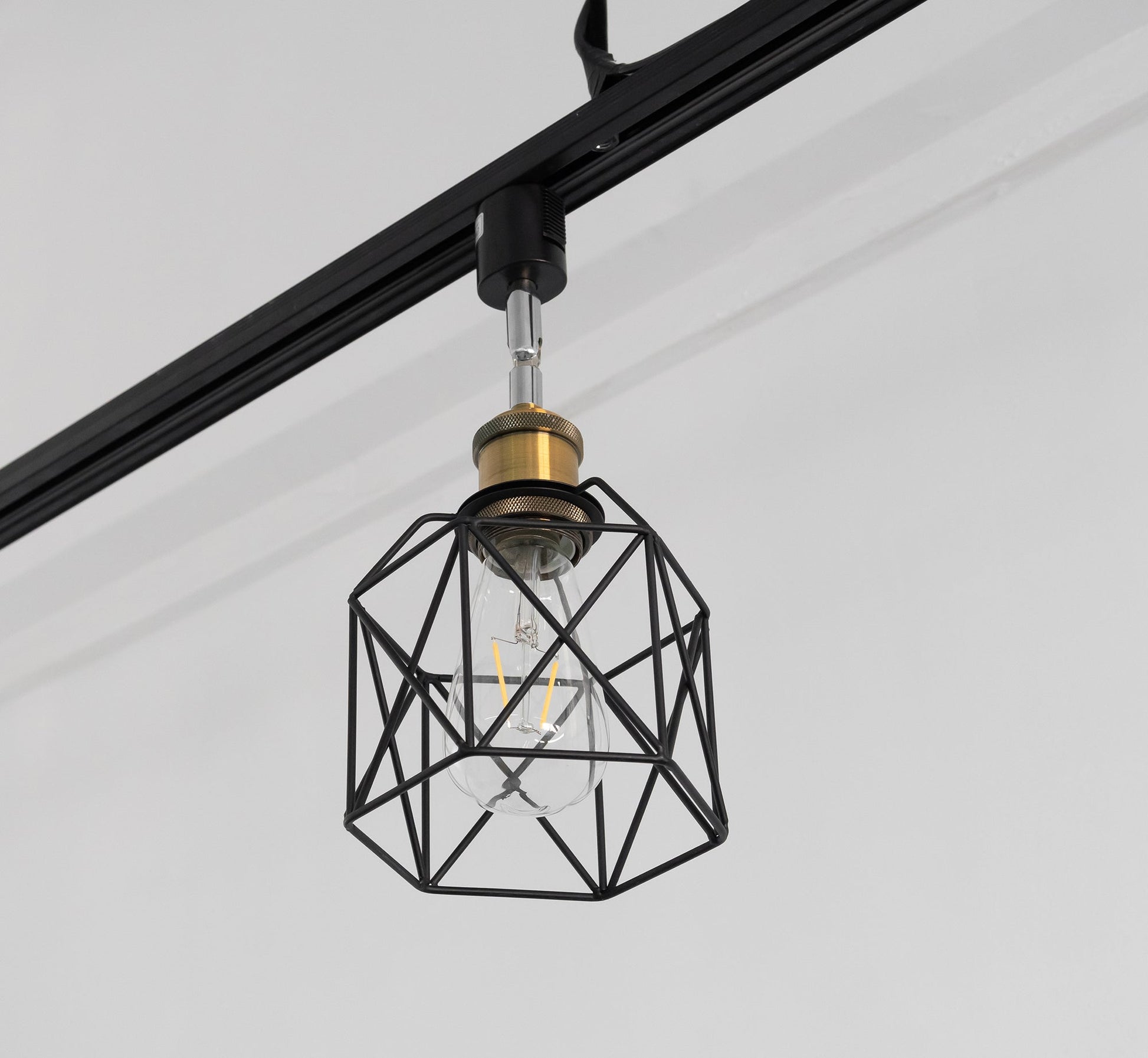 Black geometric track light with cage shade and Edison bulb, rotatable and adjustable vintage design