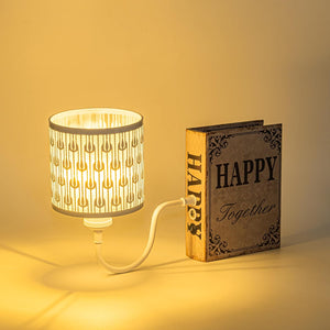 Kiven Cordless Bookshelf Lamp with iron lampshade, rechargeable bookcase lighting, and 'HAPPY Together' bookend.