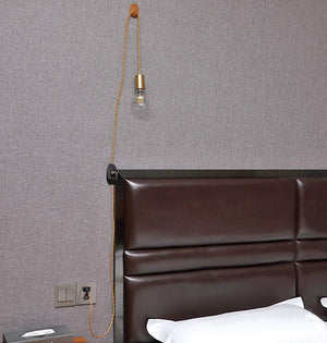 Gold cloth cord pendant light with Edison bulb, a stylish vintage lighting fixture for bedroom or DIY projects.