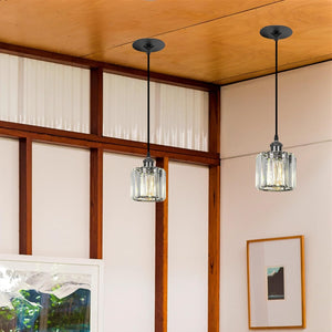 Kiven pendant lights with crystal shades and black finish, ideal for replacing recessed lighting in a dining room or hallway.