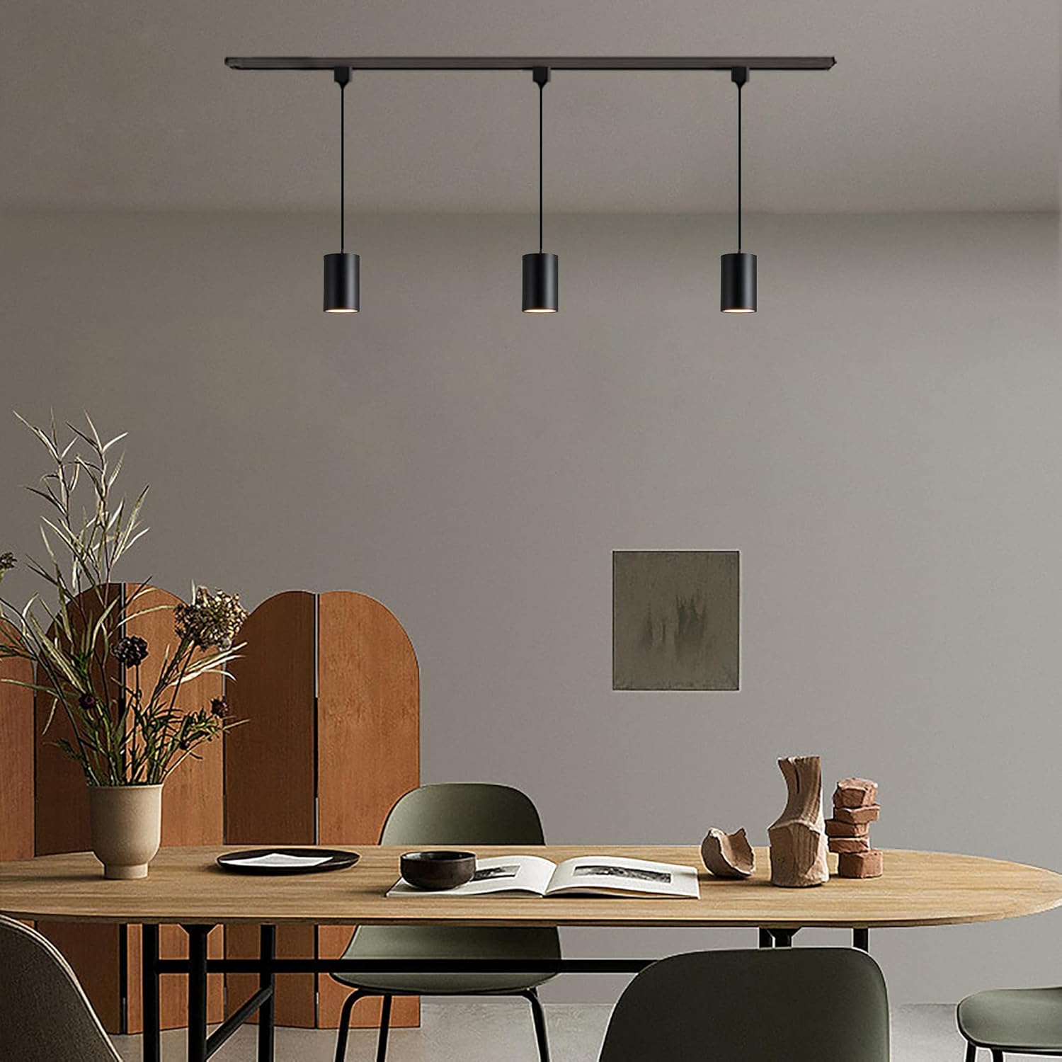 Black track pendant lights over a dining table, adjustable COB LED dimmable, Kiven Lighting.