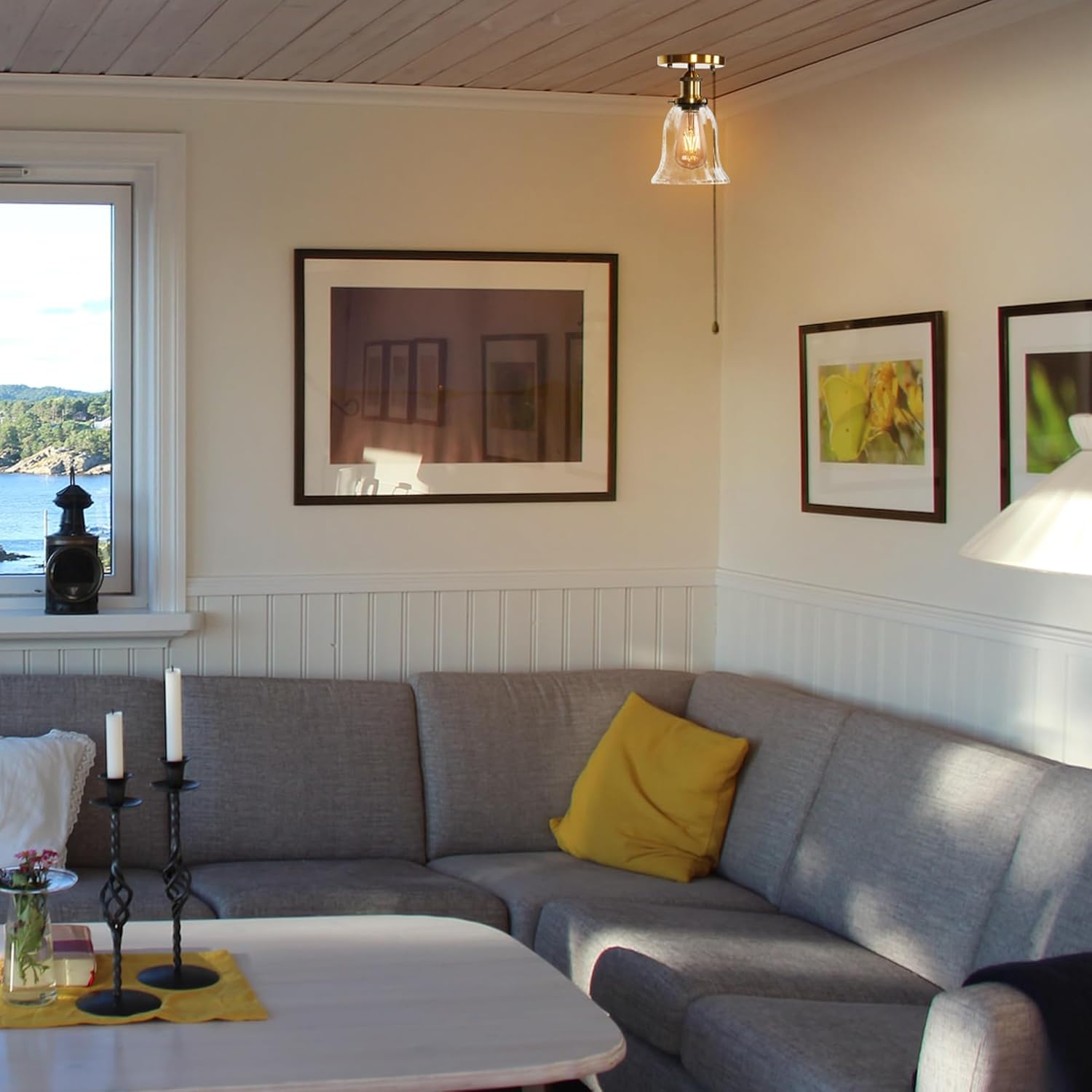 Gold RV Bell Ceiling Light, clear glass shade, vintage style, ideal for RV lighting, in a cozy living space.