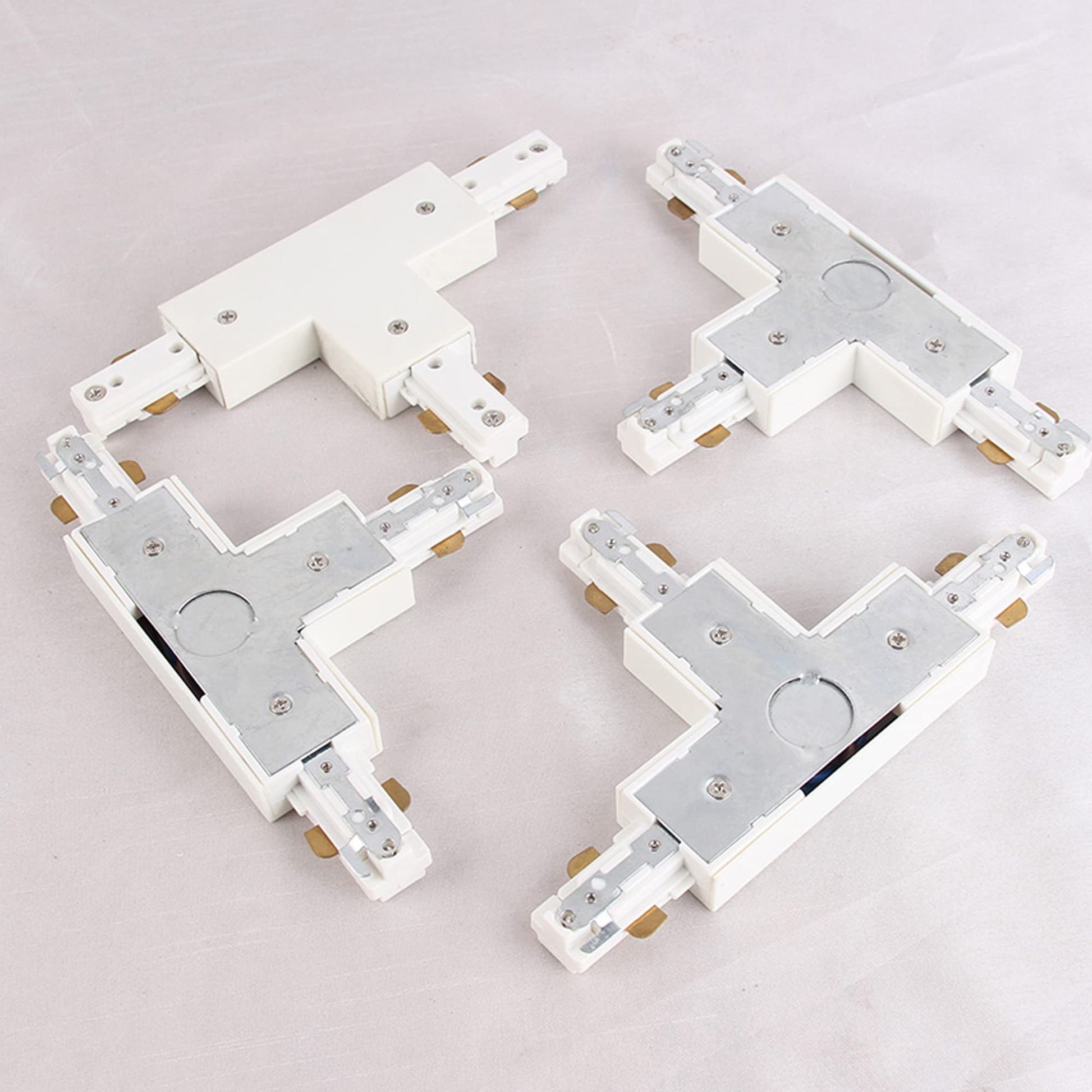 White H-type T-connectors for Halo track lighting system. PC material, connects three track sections.