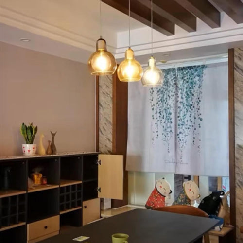 Kiven pendant lights, gold glass shades, modern design, ideal for kitchen, bedroom, or shop lighting.