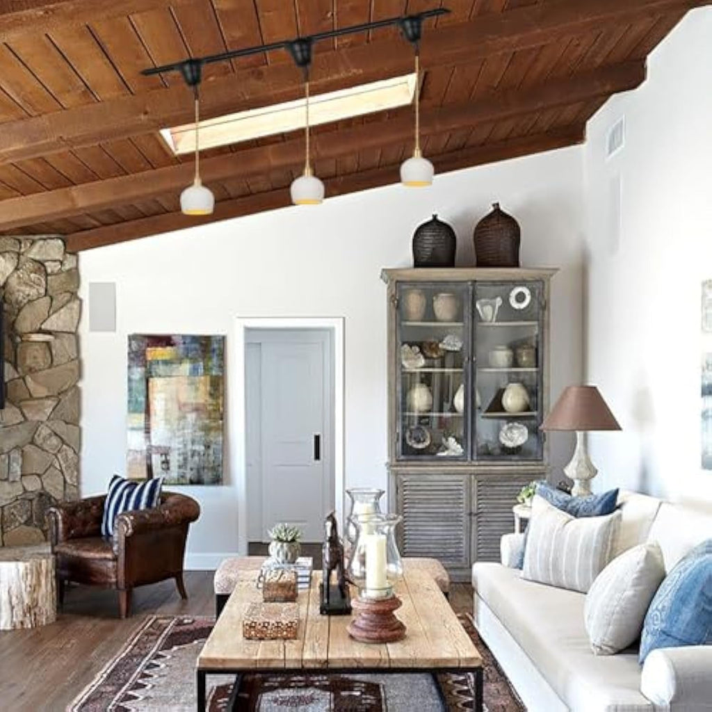 White ceramic pendant lights on track lighting, ideal for sloped ceilings. Kiven Lighting vintage style lighting.
