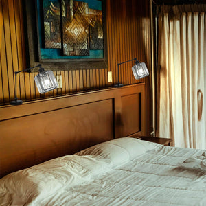 Kiven Headboard Reading Lamps with crystal shades on a dark wooden headboard, providing dimmable LED bedside light.
