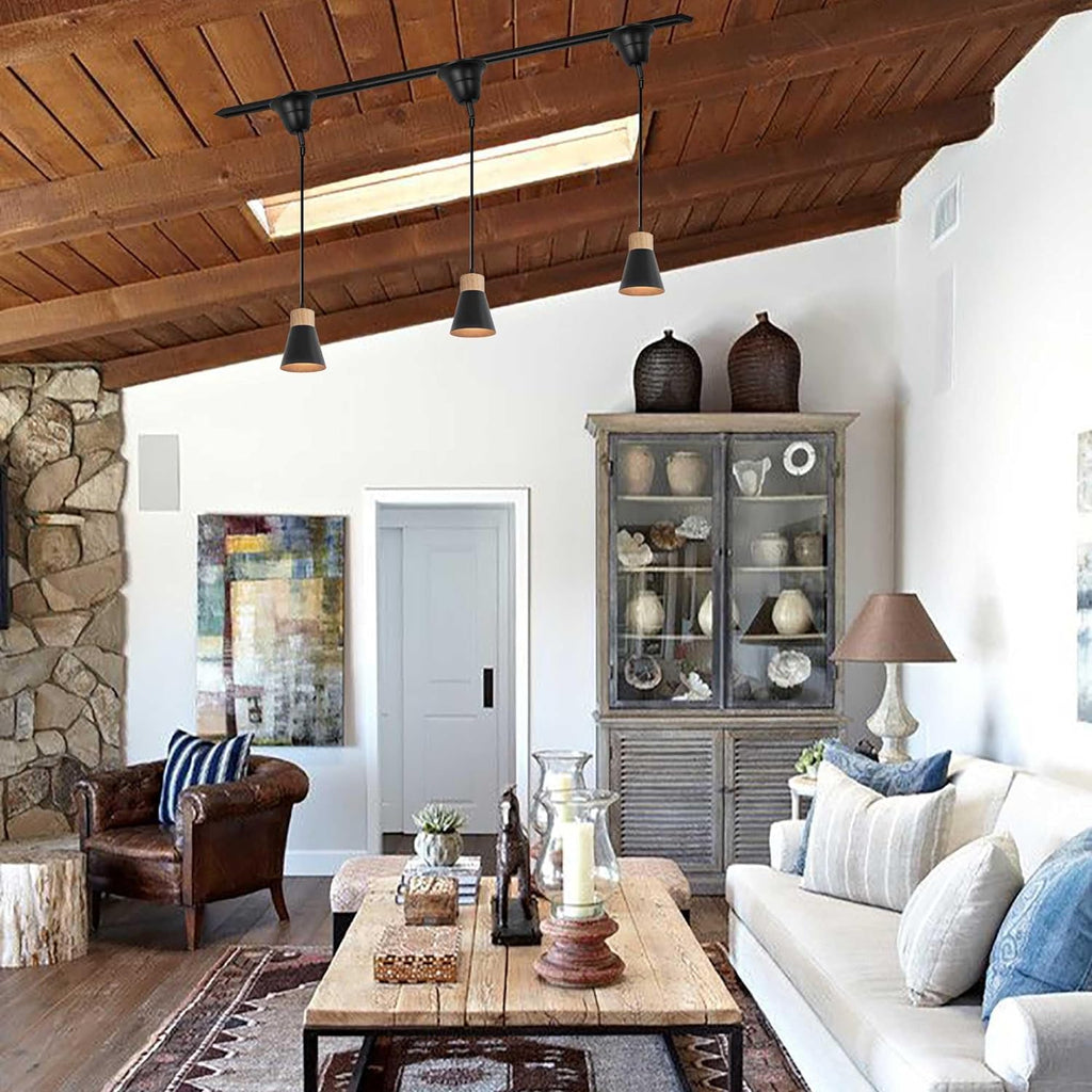 Black metal track light with wood base pendant lighting in a vintage-style living room. Adjustable cord retro pendant light.