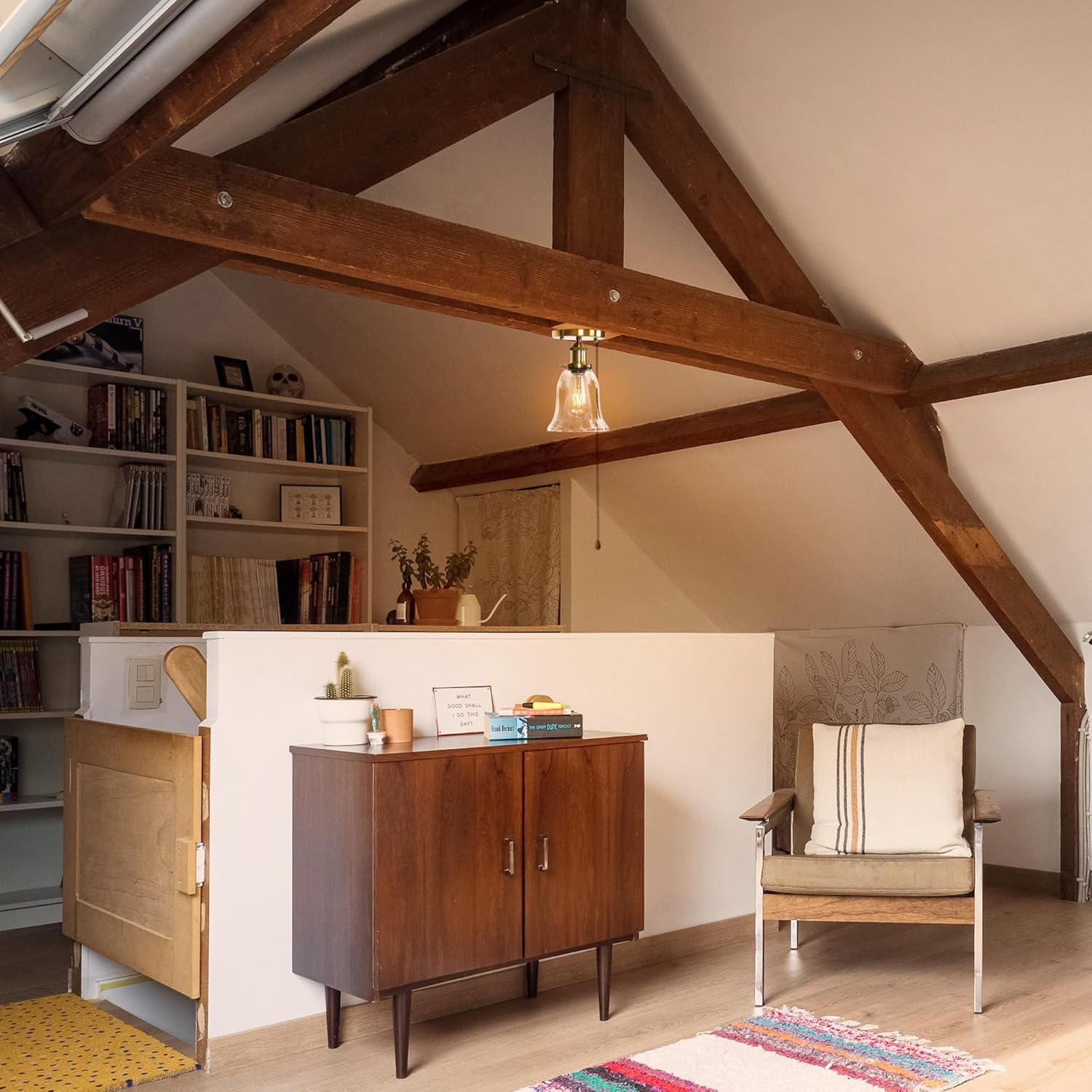 RV Bell Ceiling Light in gold finish, clear glass shade, hanging from a rustic wood beam in a cozy living space.