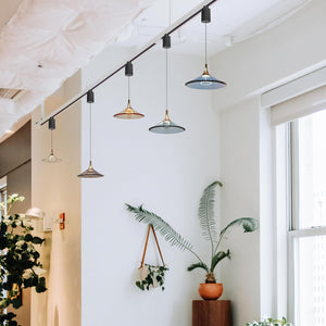 Kiven track pendant lights with acrylic shades. Ideal for modern kitchen island lighting and home decor.