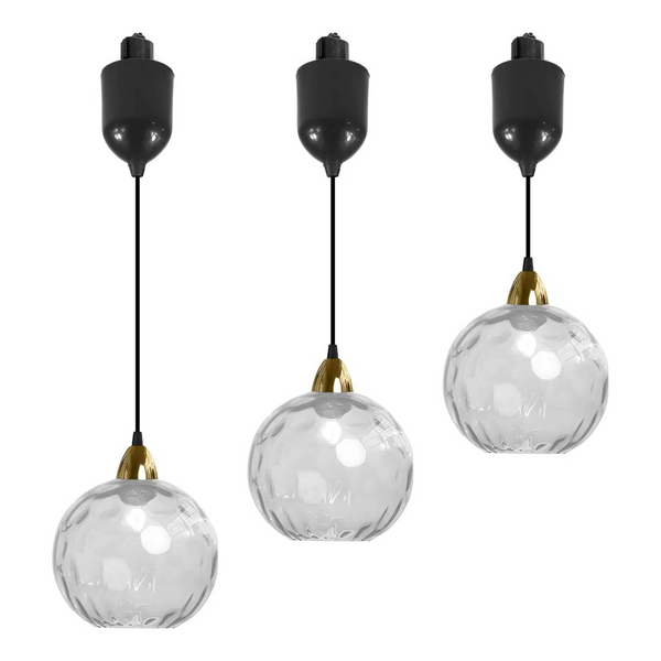 Three clear hammered glass Juno track pendants with black cord and adjustable height, ideal for kitchen or bar lighting.