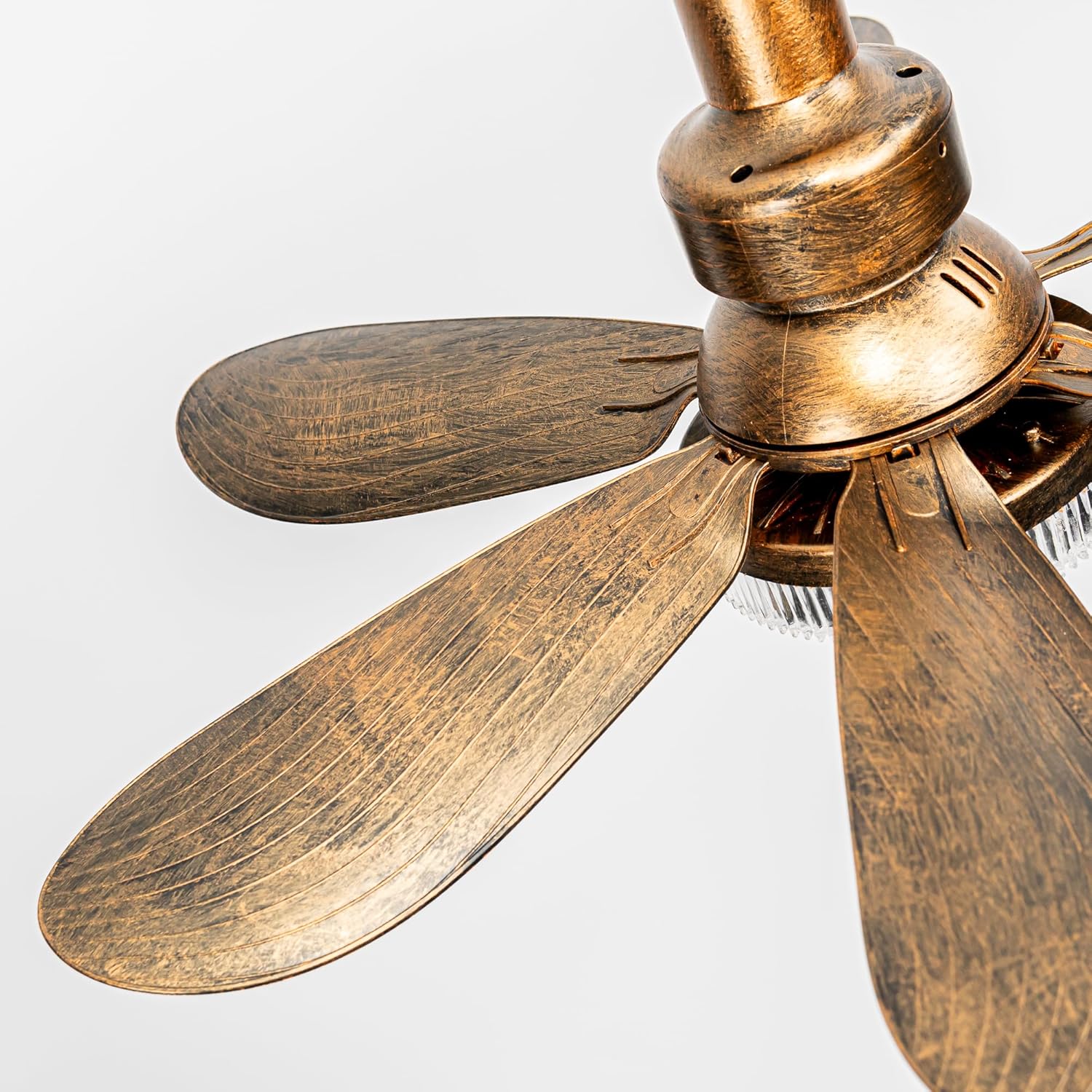 A detailed close-up shot of the antique bronze finished blades on a retro-style small track ceiling fan. The 6 blades feature a realistic brushed metallic texture, and the motor housing shows a weathered vintage look, designed for industrial or farmhouse decor.