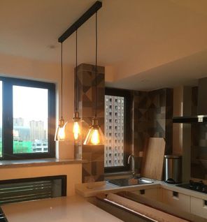 Kiven track pendant light with crystal glass globe lampshades in a modern kitchen setting, customizable lighting fixture.