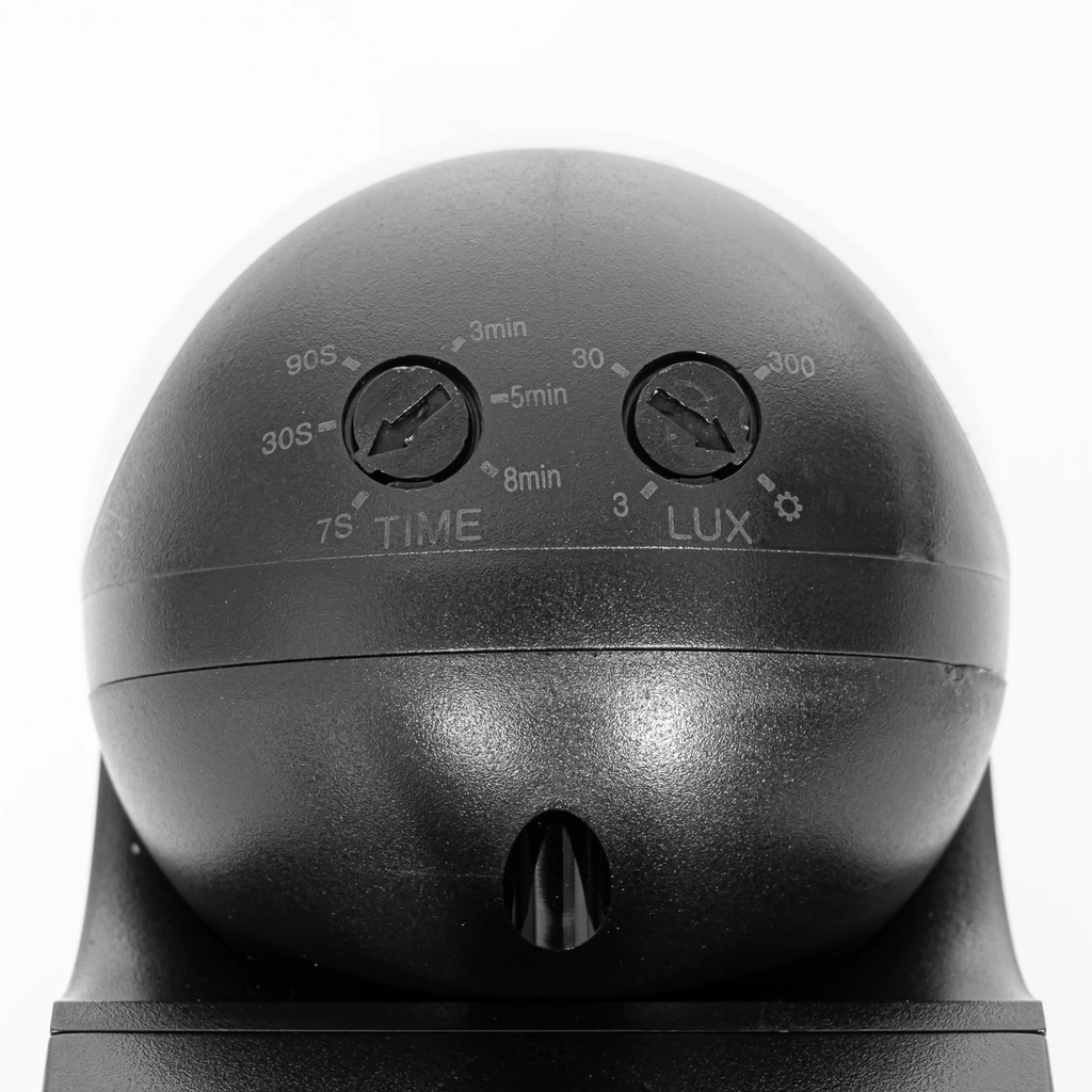 Close-up of manual TIME and LUX adjustment dials on plug-in motion sensor controller