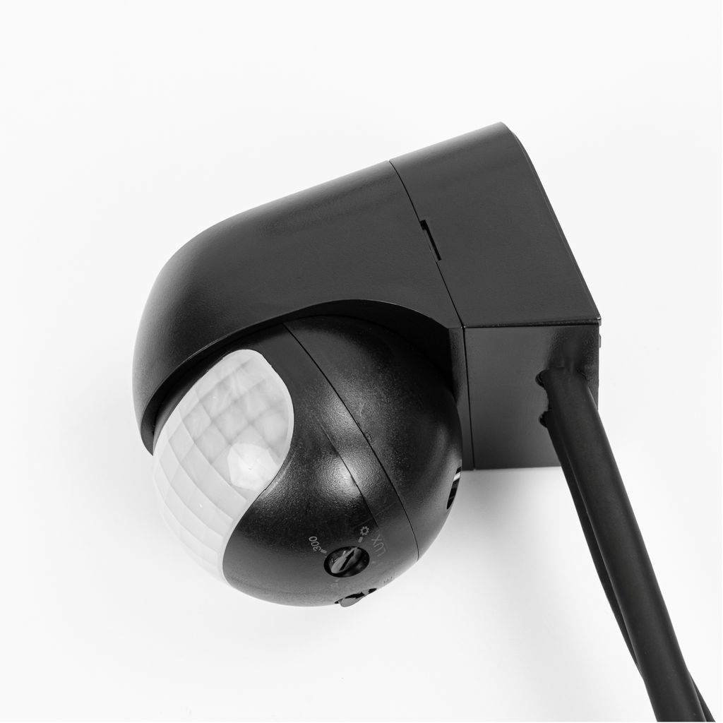 Black weather-resistant 180-degree infrared motion detector sensor head for outdoor lighting