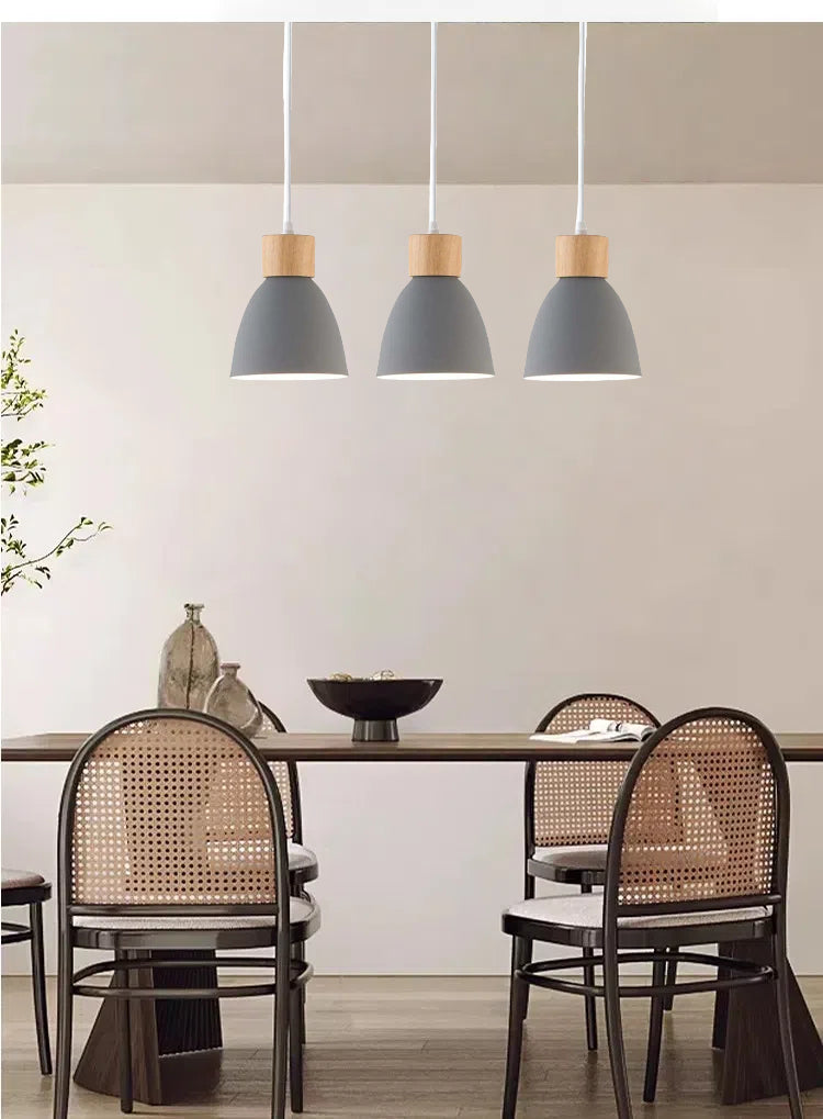 Grey Macaron track pendant lights over dining table, wood accent, Kiven Lighting, perfect for dining room decor.