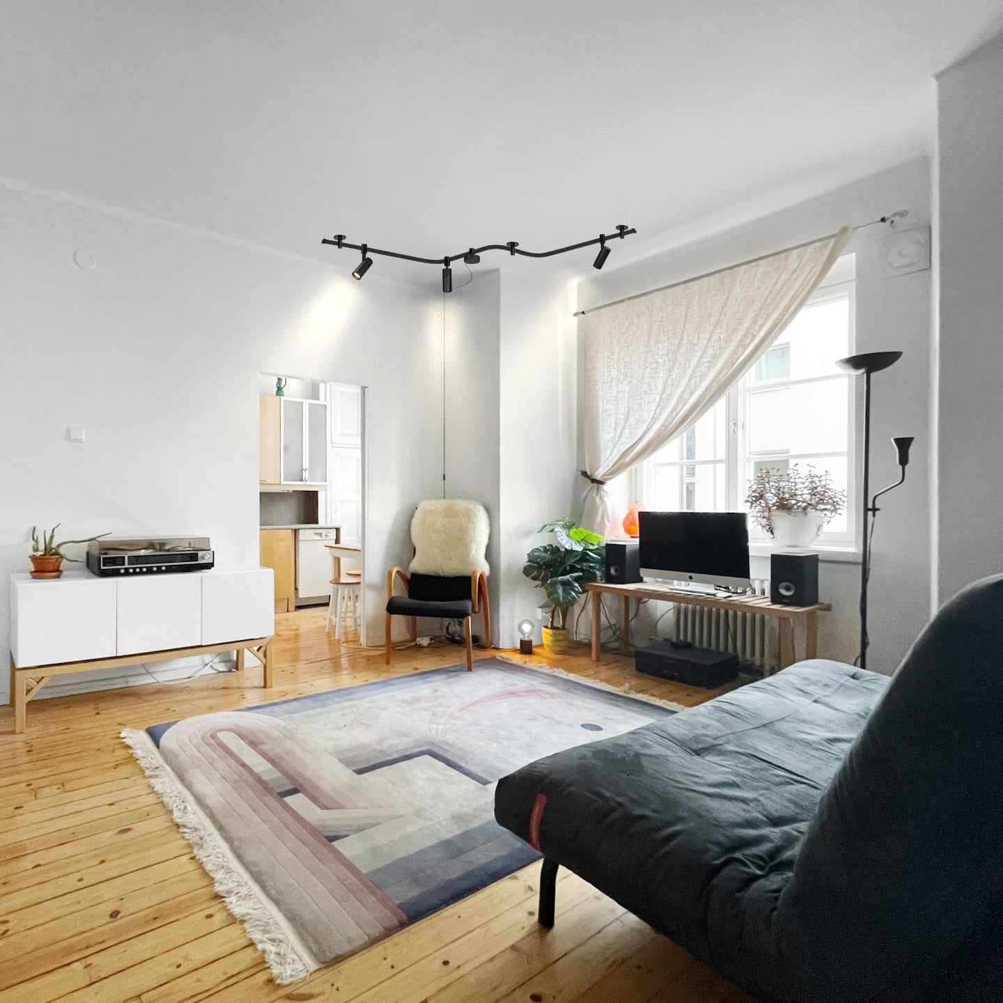 Kiven LED track light in modern living room, showcasing modular design and customizable lighting.