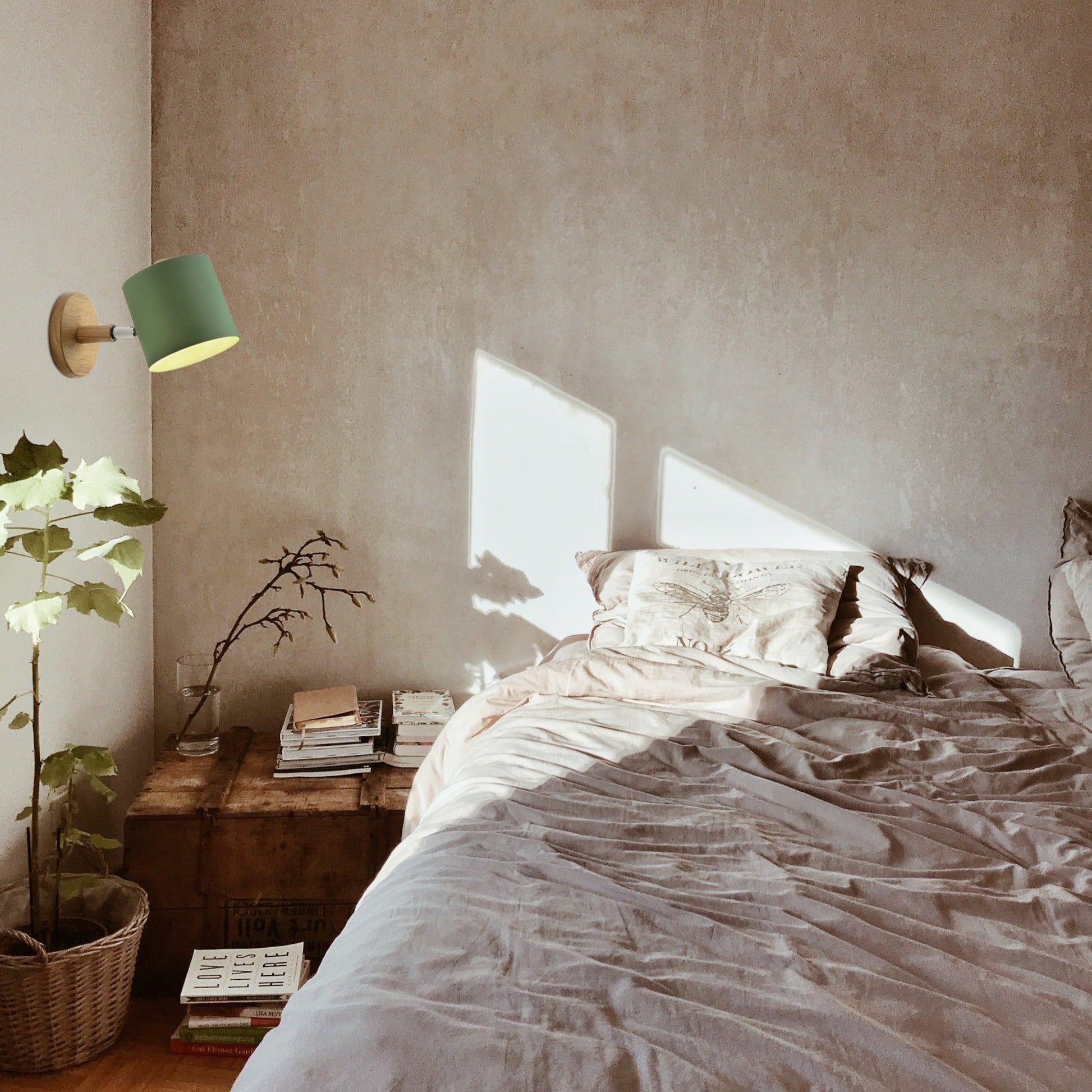 Green cylinder shade adjustable wall sconce, wood base, Kiven Lighting, bedroom interior design.